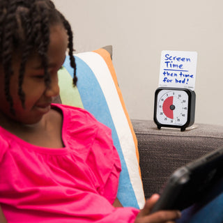 Time Timer Original 3 inch Visual Timer - Pocket. The Time Timer 3-inch is shown with a girl playing on a tablet or I-Pad. The Time Timer 3 inch is perfect for managing screentime for children. The included Dry Erase Activity Card can be used to document what the timer is being used for, and what activity will come next. 