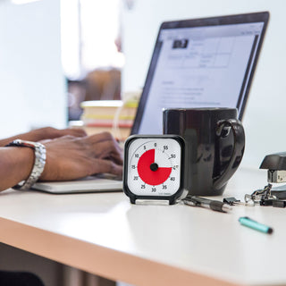 Time Timer Original 3 inch Visual Timer - Pocket. The Time Timer 3-inch is shown on a desktop with pens, coffee cup and laptop. The Time Timer 3" is perfect for work. It's small and portable, and easy to use for individual task management and productivity. 
