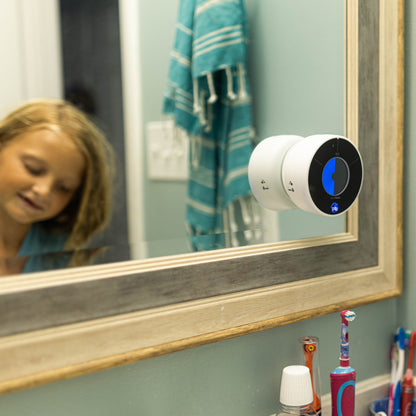 A child using the Time Timer WASH at home to wash her hands properly