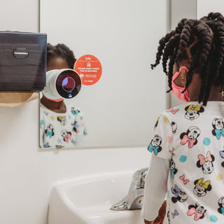 Preschool aged student Using the Time Timer WASH product to learn handwashing